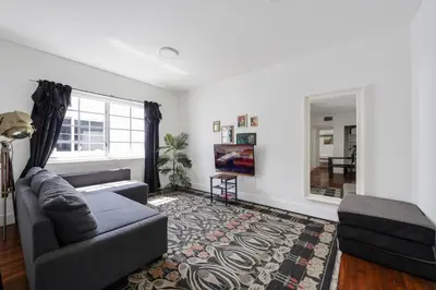 a living room with a couch and a rug at Alton Apts By At Mine Hospitality in Miami Beach