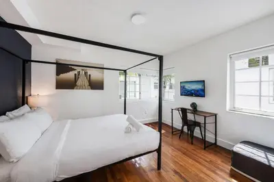 a bedroom with a bed and a desk in it at Alton Apts By At Mine Hospitality in Miami Beach