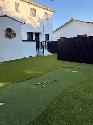 a golf ball on the grass in a yard at 76 Tropical Retreat in Miami in Miami