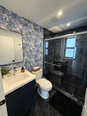 a bathroom with a toilet and a sink and a shower at 76 Tropical Retreat in Miami in Miami