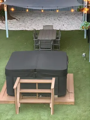 a bed and a table and a table and chairs at 78 Tropical soak in Miami