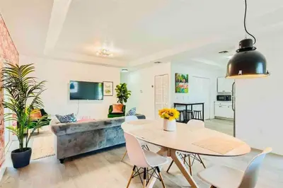 a dining room and living room with a table and chairs at 397 A - Beautiful Home in Miami in Miami