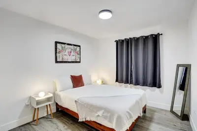 a white bedroom with a bed and a window at 397 A - Beautiful Home in Miami in Miami