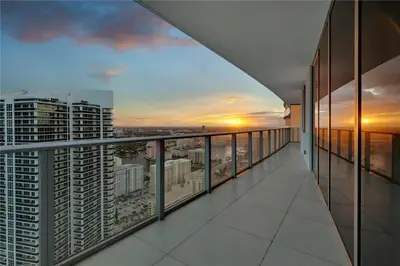 a balcony with a view of a city at Prime Oceanfront 3BR Mansion in the Sky in Hollywood