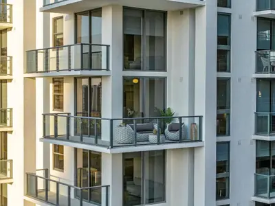 an apartment building with balconies and furniture at The Crosby Miami Worldcenter Downtown Miami in Miami