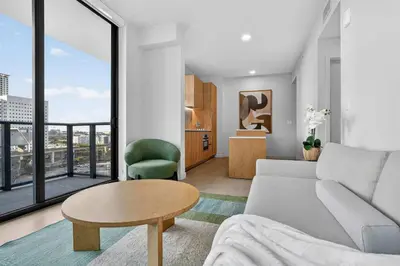 a living room with a couch and a table at The Crosby Miami Worldcenter Downtown Miami in Miami