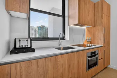 a kitchen with a sink and a window at The Crosby Miami Worldcenter Downtown Miami in Miami