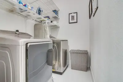 a laundry room with three washer and dryer at Easy Park and University Access! Family Miami Escape in Miami