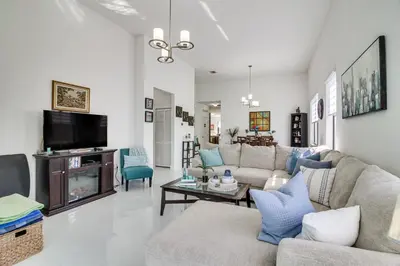 a living room with a couch and a tv at Easy Park and University Access! Family Miami Escape in Miami
