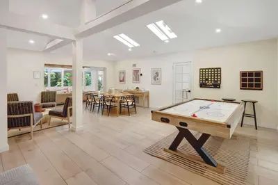 a living room with a ping pong table in it at Casa in Tropic Paradise with Pool and BBQ in Biscayne Park