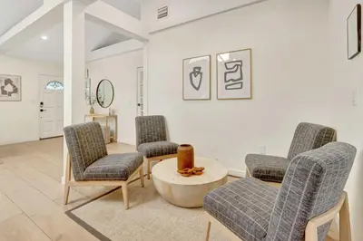 a living room with three chairs and a table at Casa in Tropic Paradise with Pool and BBQ in Biscayne Park