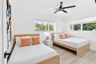 a bedroom with two beds and a ceiling fan at Spacious Miami 4BR Retreat with Pool & BBQ in Miami