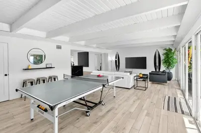 a living room with a ping pong table in it at Spacious Miami 4BR Retreat with Pool & BBQ in Miami