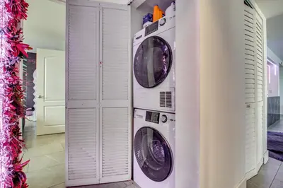 two washer and dryer units in a room at Luxe Miami Vice Condo! Bay Views and Pool Access in Miami