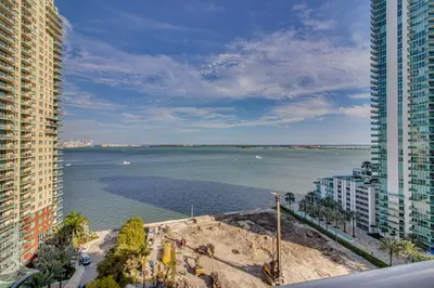 a view of the ocean from a building at Luxe Miami Vice Condo! Bay Views and Pool Access in Miami