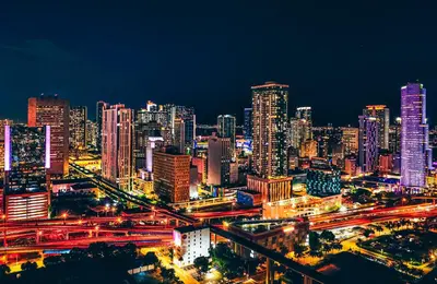 a night view of a large city with buildings at Prime Miami location - Modern Skyline Stay in Miami