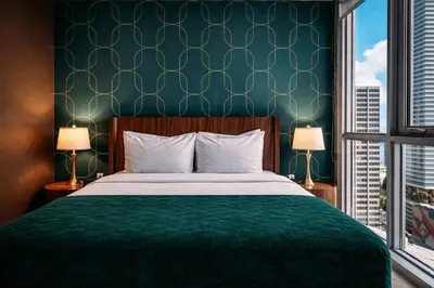 a bedroom with a bed and a green wall at Miami Bay Million-Dollar View | Private Condo in Miami