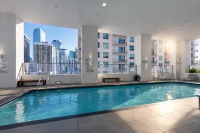 a swimming pool in a building with a view of the city at Miami Bay Million-Dollar View | Private Condo in Miami