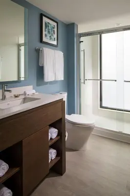 a bathroom with a sink and a toilet and a window at Residence Inn by Marriott Miami Beach South Beach in Miami Beach