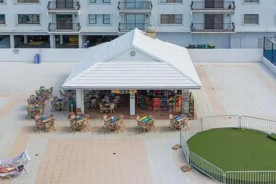 an overhead view of a building with a tent and chairs at Castle Beach Club Apartments in Miami Beach