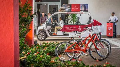 a bike parked in front of a golf cart at Beachwalk Resort Residence in Hollywood