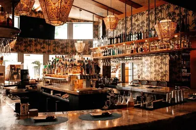 a bar with a lot of bottles of alcohol at The Plymouth South Beach in Miami Beach