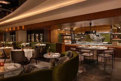 a restaurant with tables and chairs and a bar at Pier Sixty-Six in Fort Lauderdale
