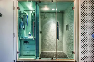 a shower with a glass door in a bathroom at Dream South Beach, by Hyatt in Miami Beach