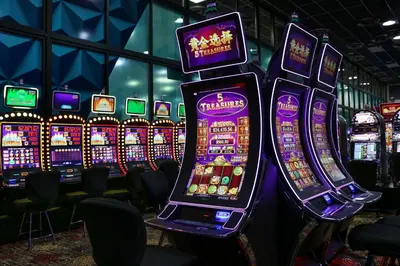a bunch of slot machines in a casino at Miccosukee Casino & Resort in Miami