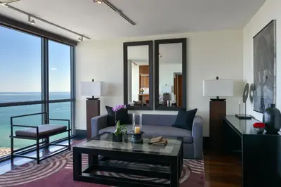 a living room with a couch and a table at The Setai, Miami Beach in Miami Beach