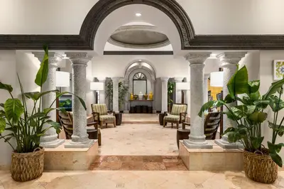 a lobby with chairs and potted plants at Lexington by Hotel RL Miami Beach in Miami Beach