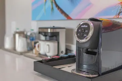 a clock sitting on top of a kitchen counter at Radisson Resort Miami Beach in Miami Beach