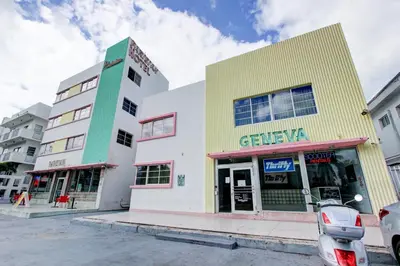 a group of buildings on a street at Geneva Hotel in Miami Beach