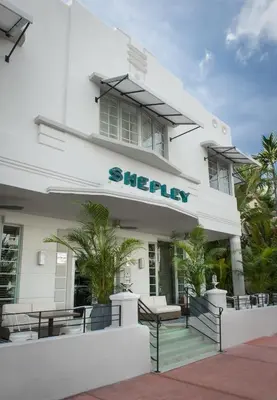 a white building with a sign on it at Shepley South Beach Hotel in Miami Beach
