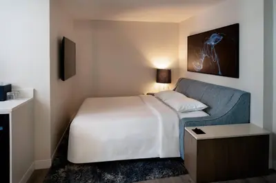 a hotel room with a bed and a couch at Hollywood Beach Marriott in Hollywood