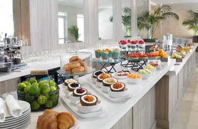 a buffet line with many different types of food at Grand Beach Hotel in Miami Beach