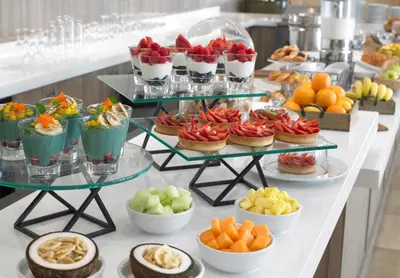 a buffet with many different types of fruits and desserts at Grand Beach Hotel in Miami Beach