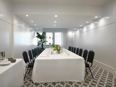 a conference room with a white table and chairs at Grand Beach Hotel in Miami Beach