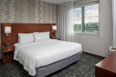 a hotel room with a bed and a window at Courtyard by Marriott Miami West/FL Turnpike in Miami