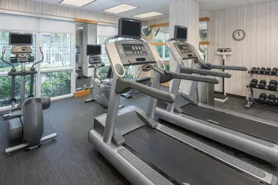 a gym with treadmills and elliptical machines at Courtyard by Marriott Miami West/FL Turnpike in Miami