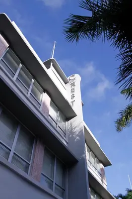 a building with a wind turbine on top of it at Crest Hotel Suites in Miami Beach