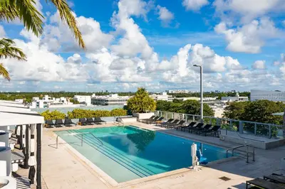 a swimming pool on the roof of a building at Liberty Park Hotel South Beach in Miami Beach
