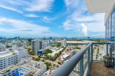 a view of a city from the balcony of a building at Oceanview Private Condo at The Setai -2402 in Miami Beach