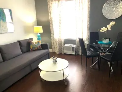 a living room with a couch and a table at Ocean Blue in Miami Beach