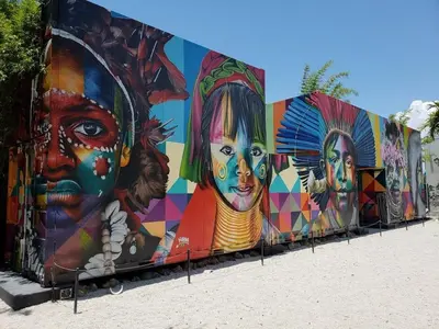 a wall with a mural of women on it at InterContinental Miami by IHG in Miami