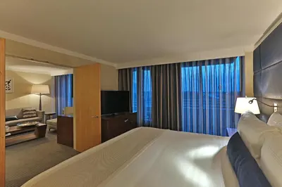 a hotel room with a large bed and a television at InterContinental At Doral Miami by IHG in Miami