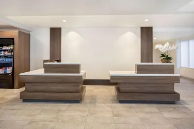 a lobby with two tables in a store at Hilton Garden Inn Miami Airport West in Miami