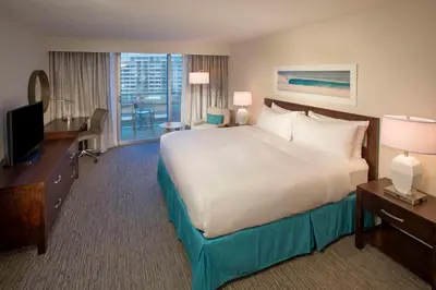 a hotel room with a large bed and a television at DoubleTree Resort Hollywood Beach in Hollywood