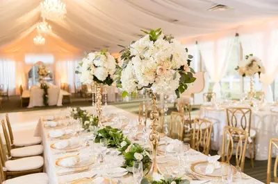 a table with white flowers on it in a room at DoubleTree Resort Hollywood Beach in Hollywood