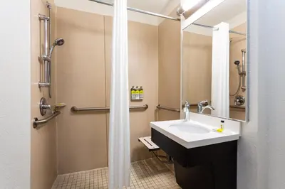 a bathroom with a sink and a shower at Candlewood Suites Fort Lauderdale Airport-Cruise by IHG in Fort Lauderdale